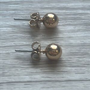 Gold stud earrings